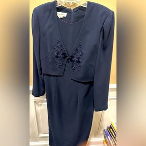 Navy blue fitted occasional dress.   3/4 length sleeve, size 6